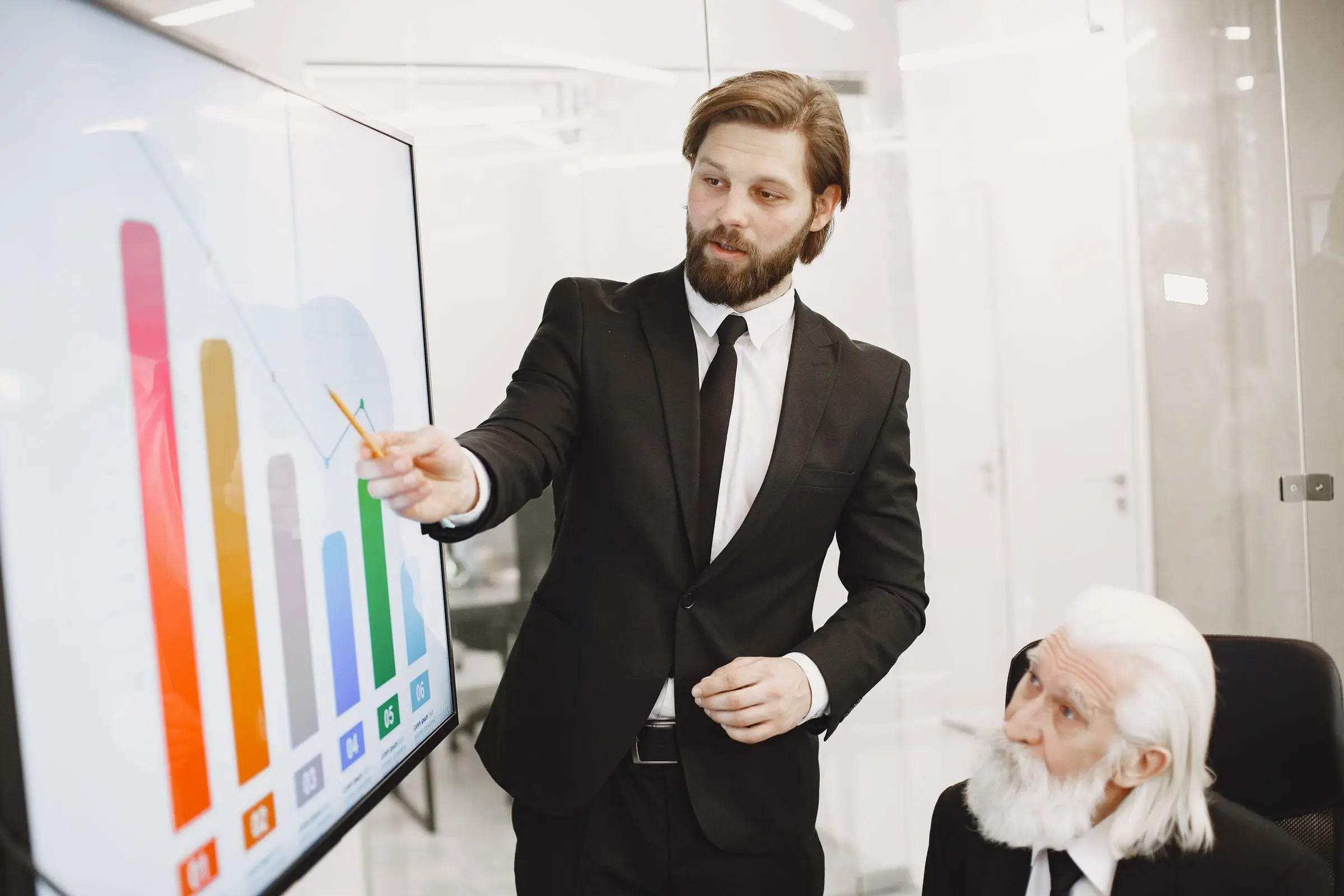 A consultant reviewing a data analysis chart with a colleague